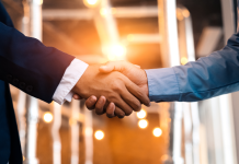 Lottery.com subsidiary enters content partnership with Data Sports Group handshake