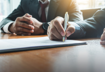Lottery.com closes $2.5m acquisition of Nook Holdings Man signing paperwork