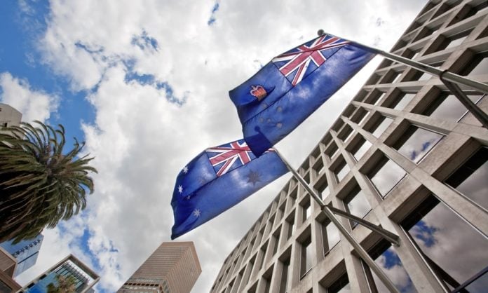 Australian,Flags,Waving,On,The,Government,Building,At,The,Number Flag of Australia flying in a street