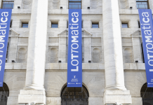 Lottomatica highlights Italy dominance with FY24 record The banner of Lottomatica placed on a building.
