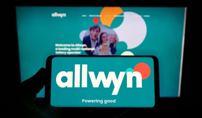 A phone screen with the Allwyn logo on it