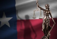 Winner of controversial $83.5m Texas jackpot goes to the courts An imageo f the Texas flag with scales of justice