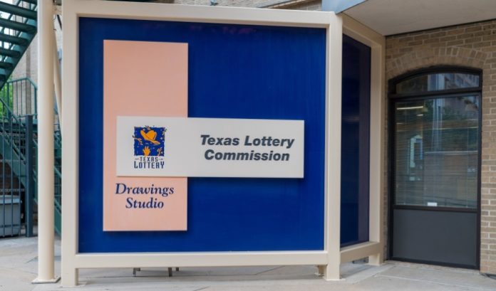 A Texas Lottery Commission booth and sign