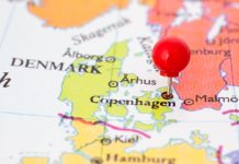 Danske Spil headlines Denmark lotteries GGR with 6% uptick A pin on a map placed on top of Denmark