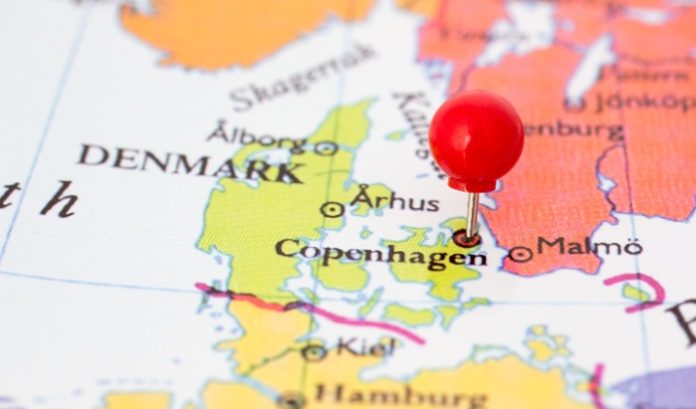 A pin on a map placed on top of Denmark