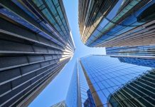EveryMatrix opens new London office to secure UK foothold A POV looking up at the glass towers of London, where the new EveryMatrix HQ is located