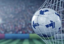 Veikkaus keeps close links to Finnish football during regulatory changes Finland flags on a football in a goal