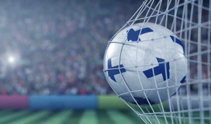 Finland flags on a football in a goal