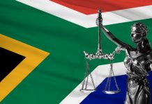 Regulator swears ‘solid progress’ on recouping misused lottery grants South Africa justice weighing scales and flag