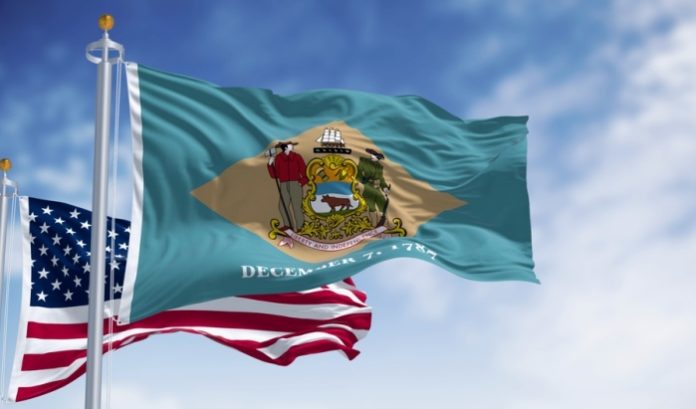 Flags of Delaware and the United States side by side