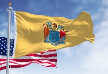 Lottery courier service TheLotter exits New Jersey Flag of New Jersey flying in front of the flag of the US