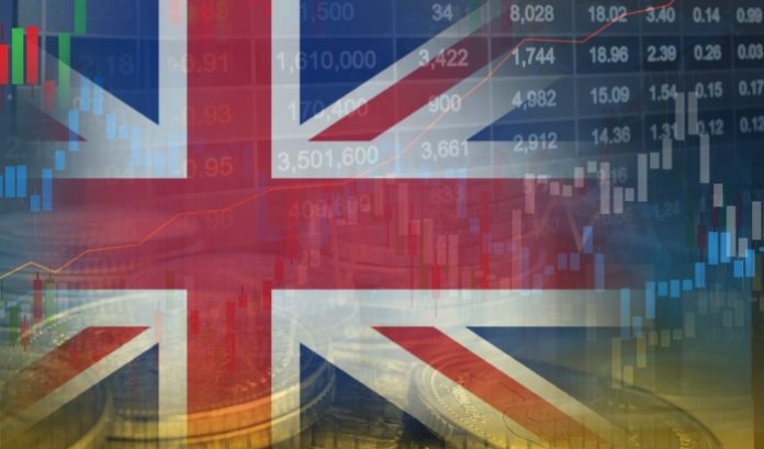 UK-flag-and-tax-rates UK flag next to coins and graphs