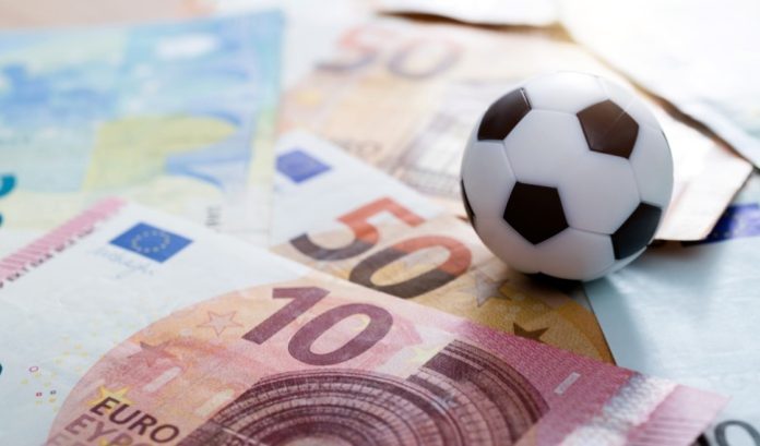 Sports-betting-and-euros A football and euros, symbolising European lotteries' sports betting growth