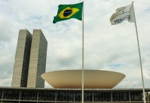 Brazil lottery association condemns betting ban proposals Brazilian flag flying over the Chamber of Deputies