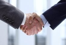 mkodo makes landmark leadership change as company hits 25 year anniversary Handshake, representing mkodo's leadership change