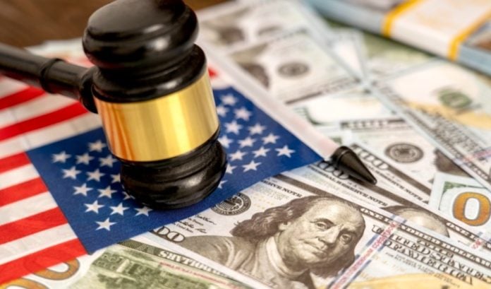 A judges gavel on top of a US flag and dollars, symbolising SEGG"s lawsuit