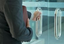 Key figure in Veikkaus foundation leaves Finnish lottery firm A businessman leaving a building, symbolising the Deputy CEO's departure from Veikkaus