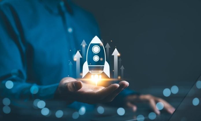 Business,Growth,Concept.,Professional,Businessman,Projecting,A,Holographic,Rocket,Symbolizing A rocket flying upwards symbolising financial growth
