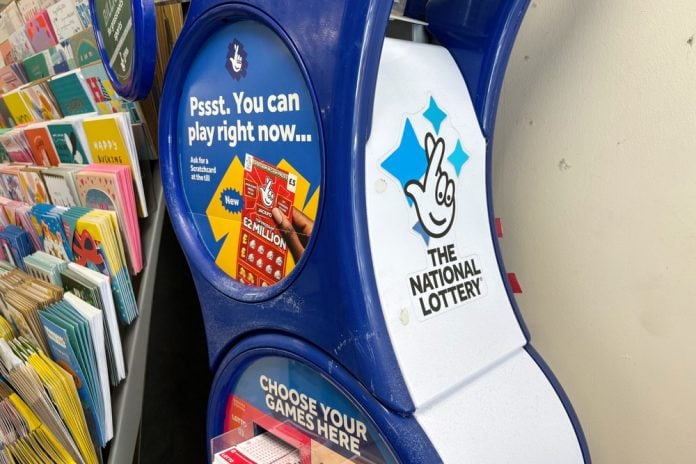 Kirkwall,,Scotland,-,July,27,,2025:,A,Stand,For,The A National Lottery retail stand in a shop, Allwyn UK operated