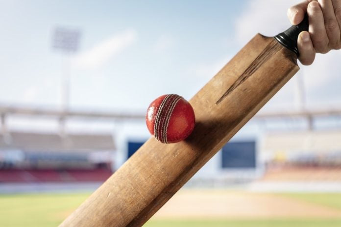 A cricket player hitting a ball, symbolising Brett Lee's role with the UAE Lottery