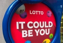 UK lottery retailers raise over £10bn in funds despite digital shifts A UK national Lottery sign outisde a shop