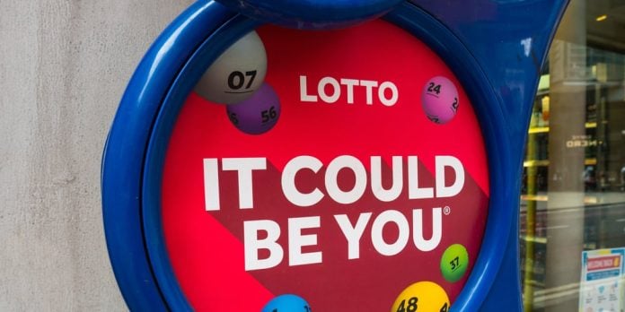 London,,Uk,,July,3rd,2021:,A,Close-up,Of,A,Shops A UK national Lottery sign outisde a shop