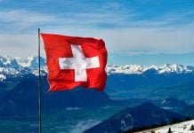 Switzerland’s Loterie Romande overhauls sports betting product A shot of the Swiss mountains with a Swiss flag in the foreground