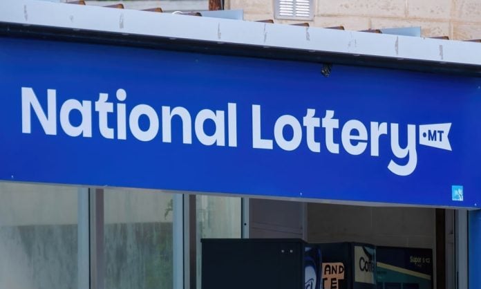 Malta National Lottery sign on a town street